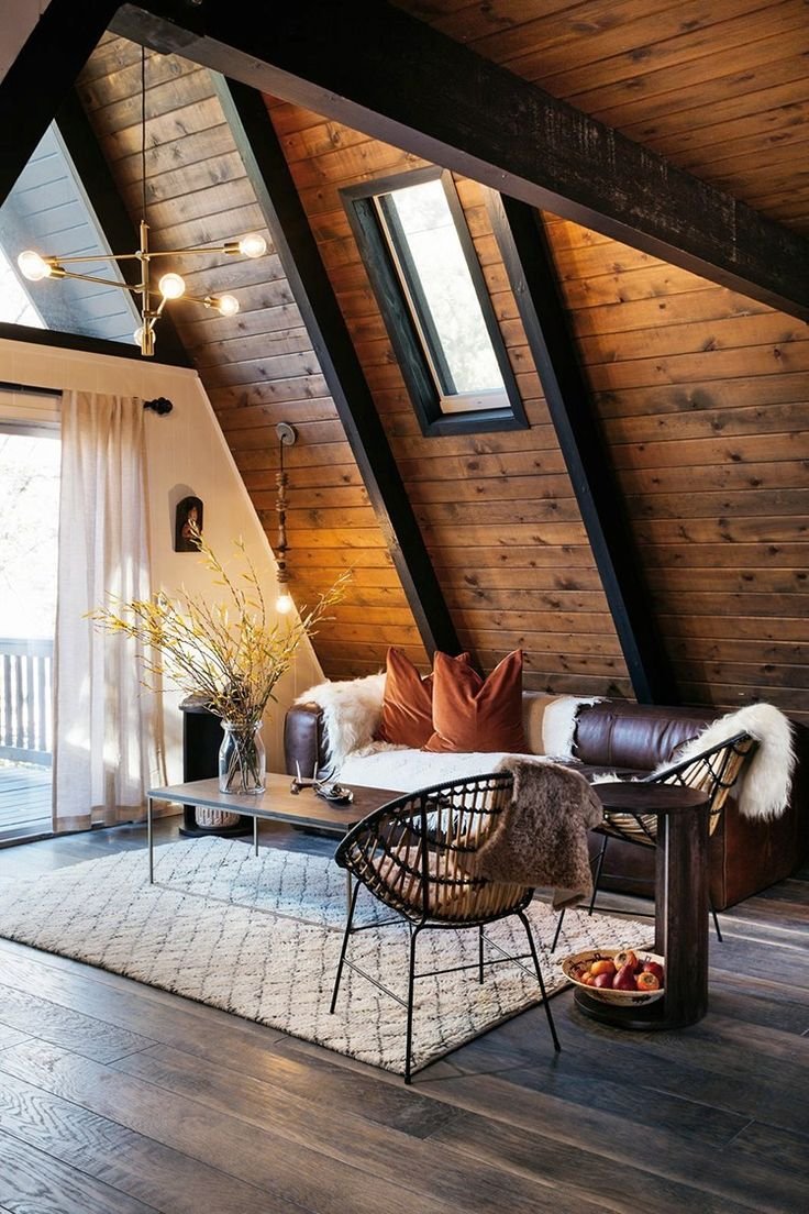 Living room without ceiling under the roof