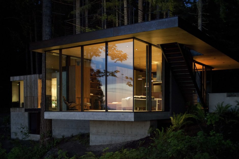Glass house in the forest