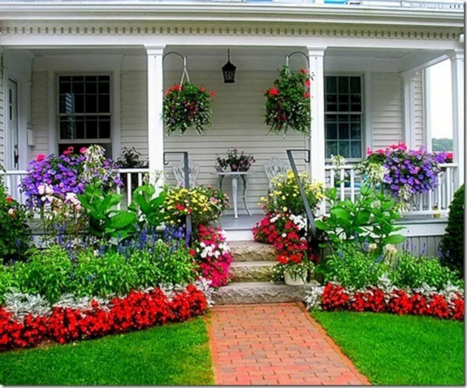 The flowerbed in front of the porch
