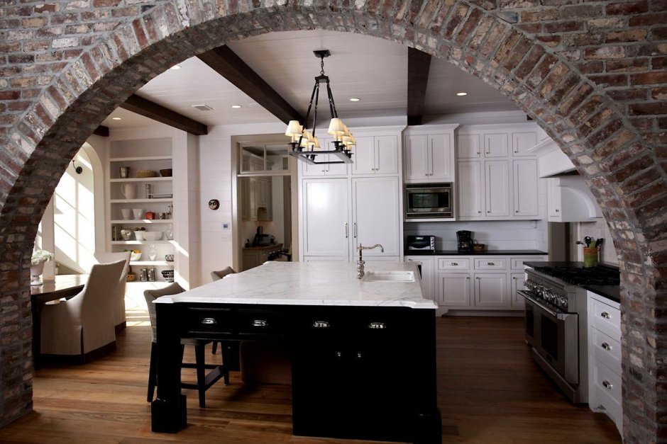 Kitchen with arch in dining room